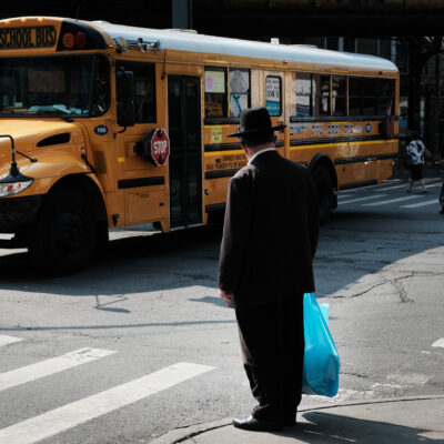 A yeshiva school bus drives through Borough Park on September 12, 2022 in the Brooklyn borough of New York City.